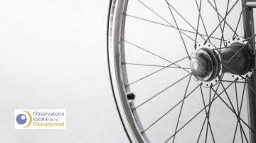 Imagen detalle de una silla de ruedas y logotipo del OED